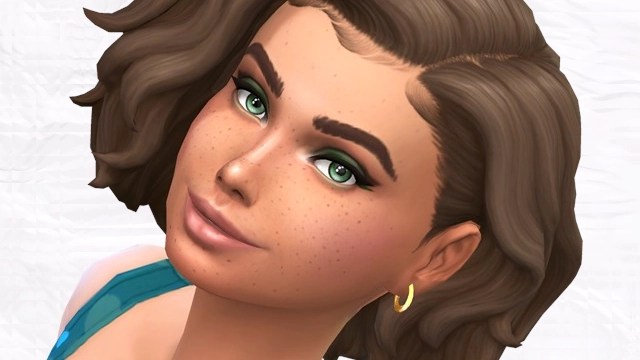 A digital illustration of a young woman with curly brown hair and green eyes, showcasing freckles and a subtle smile. She is wearing a blue outfit and a small gold hoop earring.