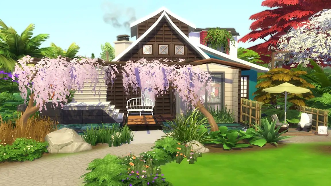 A charming wooden house surrounded by lush greenery, featuring a lilac wisteria tree in front, a pathway leading to the entrance, and a small seating area with an umbrella.