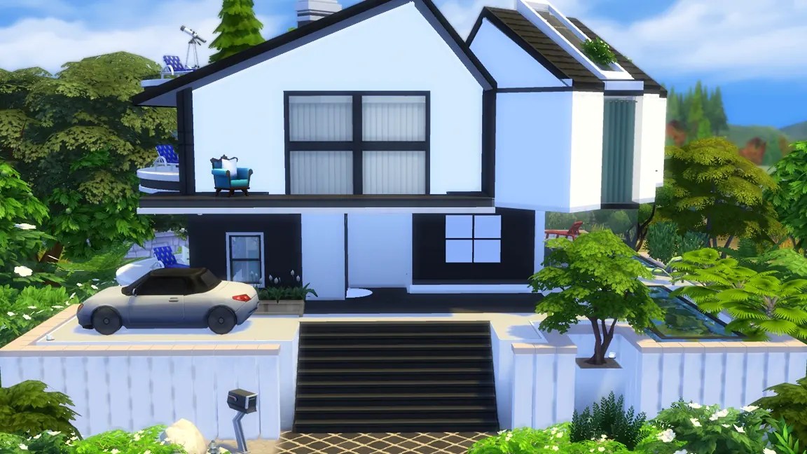 A modern, two-storey house with a black and white exterior, located in a lush garden. The front features a driveway with a parked car and a set of stairs leading to the entrance.