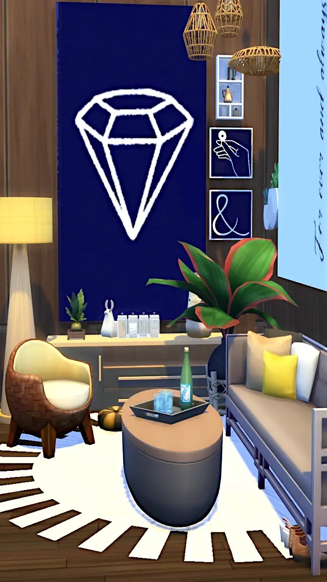 A stylish living space featuring a blue wall with a diamond design, a round coffee table with drinks and a plant, a woven chair, and a modern sofa with cushions.