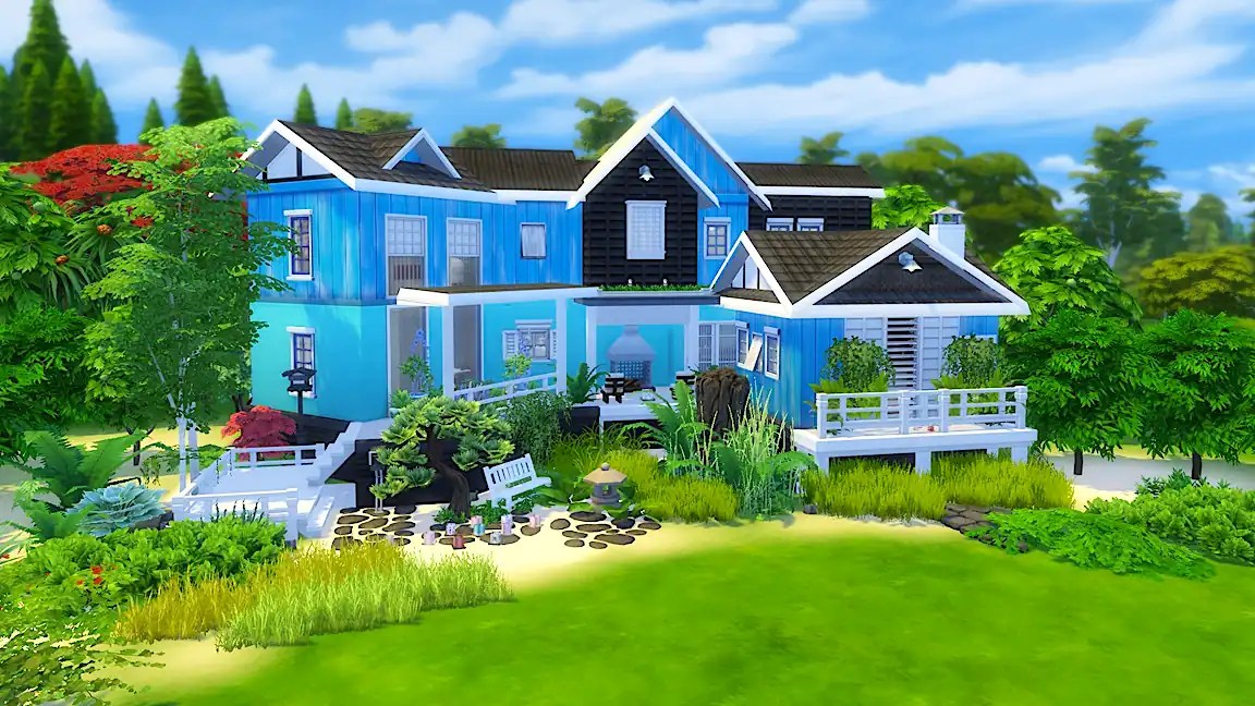 A stunning blue house surrounded by lush greenery and vibrant flowers, featuring multiple levels and a variety of architectural styles.