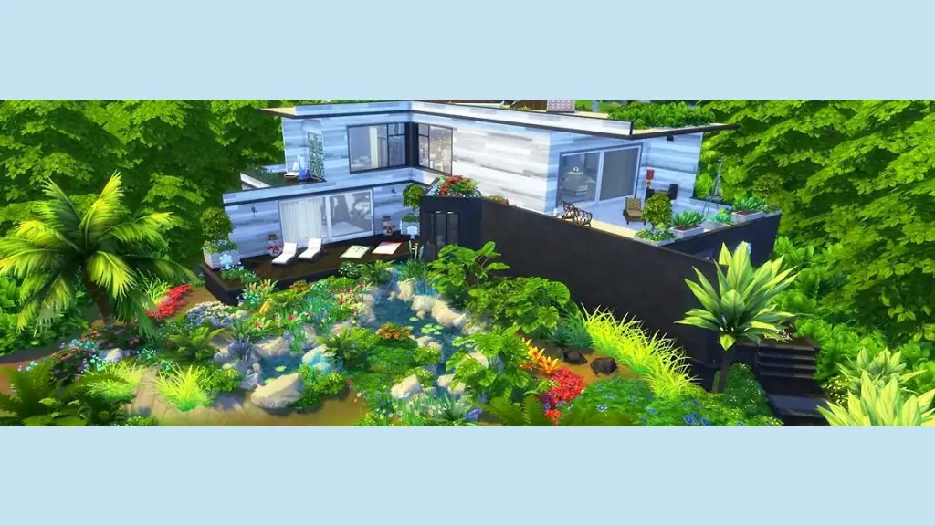 A modern house surrounded by lush greenery and colourful flowers, featuring a patio with sun loungers and landscaped gardens.